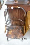 A Windsor design armchair, of traditional form with hooped spindle back and shaped open arm over a