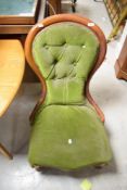 A Victorian buttoned spoon-back nursing chair, seat height 34cm