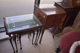 A selection of occasional furniture comprising reproduction nest of tables, oriental style plant and