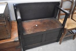 An early to mid 20th Century oak monks style bench seat , width approx. 84cm