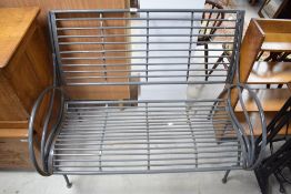 A modern painted metal garden bench, of tubular construction with shaped railed seat and back 92cm x