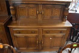 An Ercol court cupboard