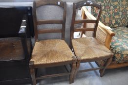 A pair of Victorian rush seated bedroom or dining chairs