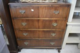 An early 20th Century walnut chest of four long drawers, width approx. 77cm