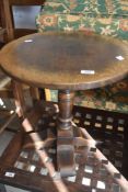 A reproduction oak occasional table, possibly Titchmarsh and Goodwin, diameter approx. 45cm