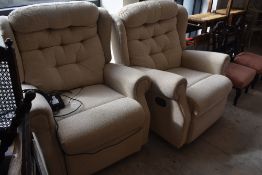 Two modern recliner chairs , in cream, one being manual , the other electric
