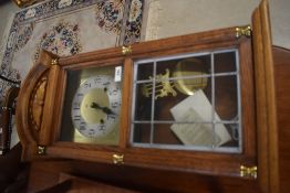A reproduction oak cased wall clock, brass dial marked RR, height approx. 64cm