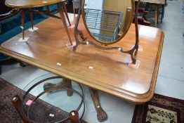 A 19th century mahogany breakfast table, of moulded rectangular form over a carved and turned column