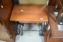 A modern nest of tables having wrought iron frames