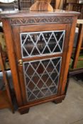 A composite music cabinet in the 19th Century style with lead style glass door, height approx.