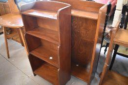 Two small bookshelves including waterfall design