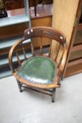 An early 20th Century oak captains chair