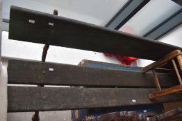 A traditional garden bench having cast frame and wood slats, width approx. 195cm