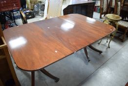 An interesting 19th Century twin pedestal dining table , having Regency supports, associated top