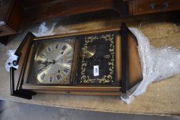 A vintage Acctime wall clock