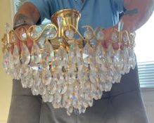 A pair of modern gilt metal and glass electric light fittings, of circular form with graduating