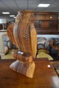 A carved wood sculpture, modelled as owl, height approx. 40cm