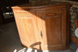 A 19th Century pine bow fronted corner cabinet of large proportions, approx. Height 92cm Width