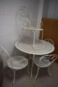 A modern re-powdered coated garden bistro style table and four chairs, table diameter approx. 97cm