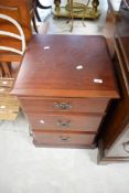 A modern laminate mahogany effect three drawer bedside chest , width approx. 48cm
