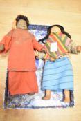 A porcelain South American doll in traditional dress, h21.5cm, sold together with similar doll, (2)