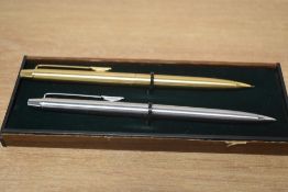 Two Papermate propelling pencils one in gold the other in brushed steel