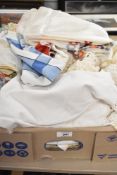 A quantity of fabric, to include tablecloths, lace and various other embroidery