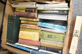 An assortment of books including titles 'The Carved Cartoon' Shelton Press and 'A Short Dictionary
