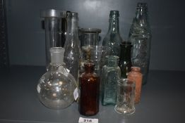 A small collection of vintage advertising and medicinal bottles etc.