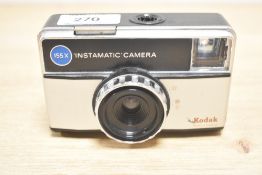 A Kodak 155X Instamatic camera and a Kodak 66 folding camera