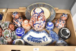 A pair of oriental Imari pattern baluster vases sold together with similar designed ginger jars