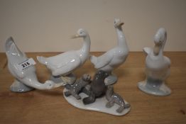 A Lladro porcelain seal family model number 5318 sold alongside group of four Nao by Lladro