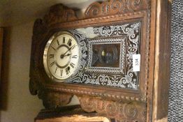 A late 19th century Ansonia (USA) Gingerbread clock having single gong chime, h56