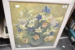 A vintage still-life print featuring daffodils in a jug, housed in large frame, unknown signature to