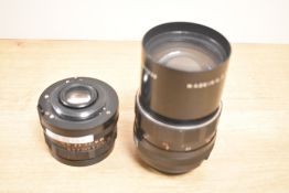 Two Pentacon M42 screw mount lenses, a Pentacon 29mm 2.8 lens and a Pentacon 135mm f2.8 lens.