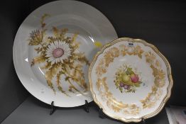 A vintage Kaiser West German Silberdistel pattern plate decorated with floral designs on a white