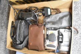 An Olympus Trip MD2 camera and a Sony Mega Movie EX digital camera