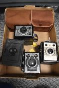 Five box cameras including a Butcher Midg No1 plate box camera, a Rex Coronet, a Kodak Six-20