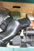 A box of various meters, flash shoes, and lenses. A MV Metrovic, a Glossan Sixan, Zeiss Ikon