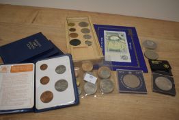 A small selection of assorted vintage coins including four collections commemorating Britain's First