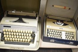 Two vintage typewriters, one Adler and the other Antares both with cases.