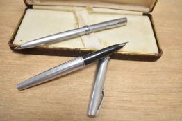 A boxed Lady Sheaffer 620 fountain pen in brushed steel with a florentine band having Sheaffer nib