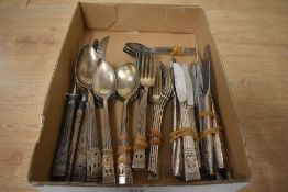 A quantity of Oneida Cornation Ware Community flatware and knives.