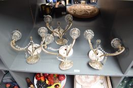 A group of four vintage cast metal candlestick wall sconces, AF.