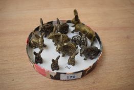 A group of eleven cast brass rabbit/hare studies.