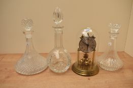 A vintage German 400 day clock in glass dome having Roman numerals to face, sold with three cut
