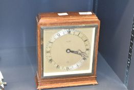 A H.Little & Son Lancaster Elliot mantel clock, having Roman numerals to face, measures 22cm tall.