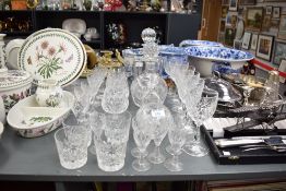 An assortment of cut glass items to include decanters and port/sherry glasses etc.