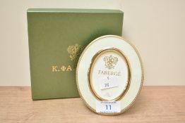 A small Faberge 'The Royal Collection' photo frame, complete with box.