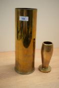 A large vintage brass artillery trench art shell casing, inscribed 'When Are The Gunners Broken,